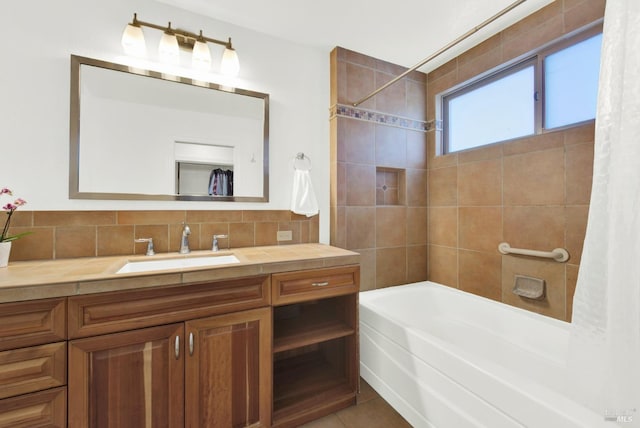 bathroom featuring backsplash, vanity, and shower / tub combo with curtain