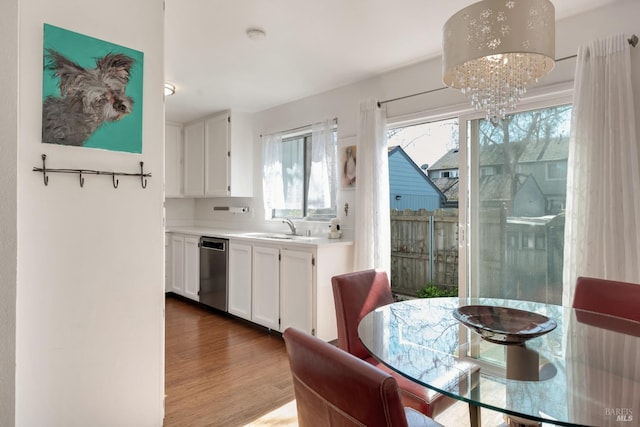 dining space featuring a chandelier and wood finished floors