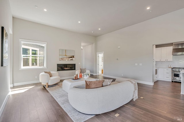 12 Rose Ct, Novato, CA 94945 - living area featuring a glass covered fireplace, dark wood-style floors, baseboards, and recessed lighting