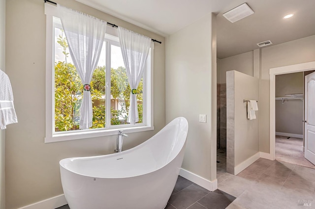 12 Rose Ct, Novato, CA 94945 - full bath with a freestanding bath, plenty of natural light, baseboards, a walk in closet, and recessed lighting
