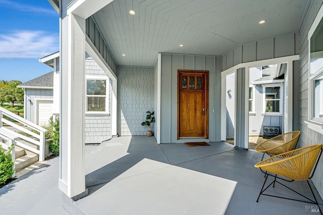 12 Rose Ct, Novato, CA 94945 - entrance to property featuring board and batten siding, roof with shingles, and a porch
