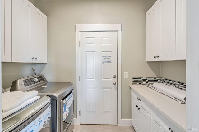 12 Rose Ct, Novato, CA 94945 - washroom with cabinet space, separate washer and dryer, light tile patterned floors, and baseboards