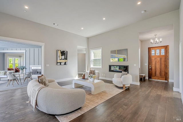 12 Rose Ct, Novato, CA 94945 - living area featuring dark wood finished floors, baseboards, a glass covered fireplace, recessed lighting, and a chandelier