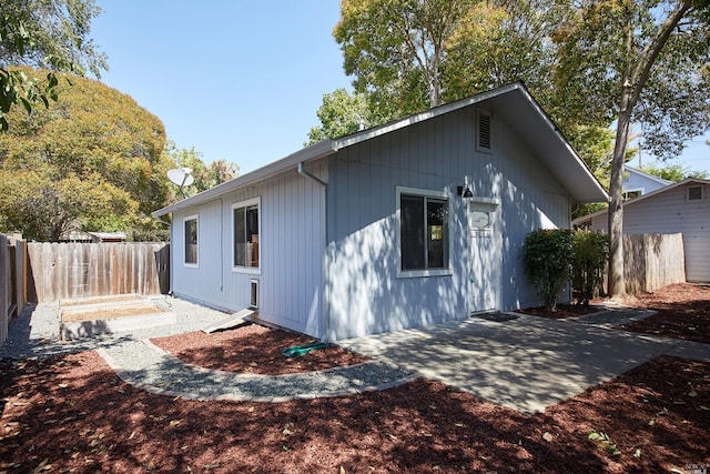 back of house featuring a patio area and a fenced backyard