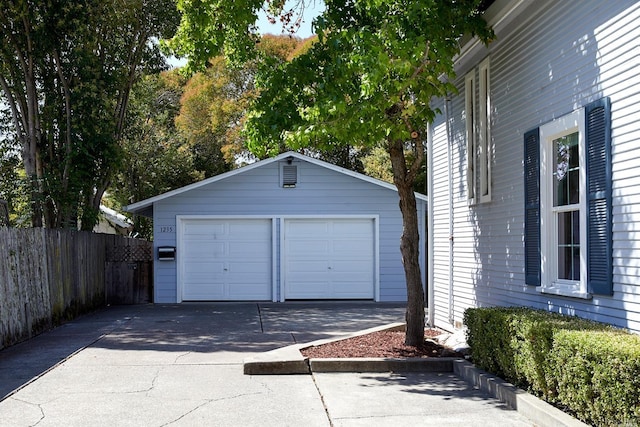 detached garage with fence