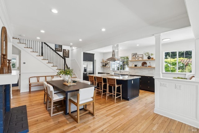 1030 Thompson Ln, Petaluma, CA 94952 - dining space with stairs, light wood-style flooring, recessed lighting, and crown molding