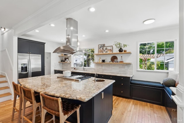 1030 Thompson Ln, Petaluma, CA 94952 - kitchen featuring open shelves, island range hood, stainless steel fridge with ice dispenser, dark cabinets, and a sink