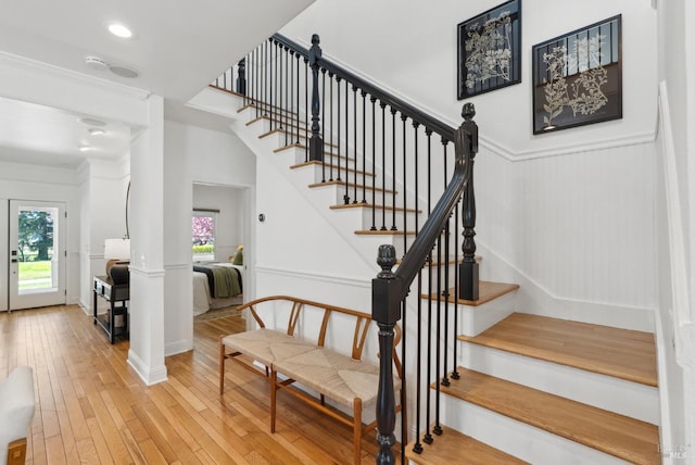 1030 Thompson Ln, Petaluma, CA 94952 - stairs featuring wood-type flooring, a wainscoted wall, and a decorative wall