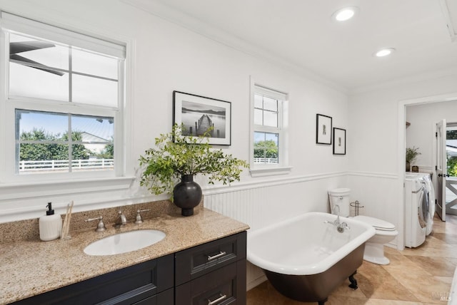 1030 Thompson Ln, Petaluma, CA 94952 - full bath featuring separate washer and dryer, a freestanding bath, vanity, ornamental molding, and a wainscoted wall