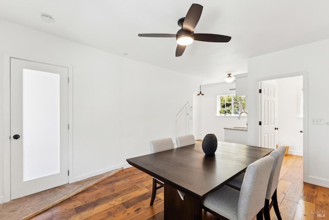 1030 Thompson Ln, Petaluma, CA 94952 - dining room featuring light wood-style flooring, ceiling fan, and baseboards