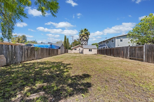 view of yard with a fenced backyard