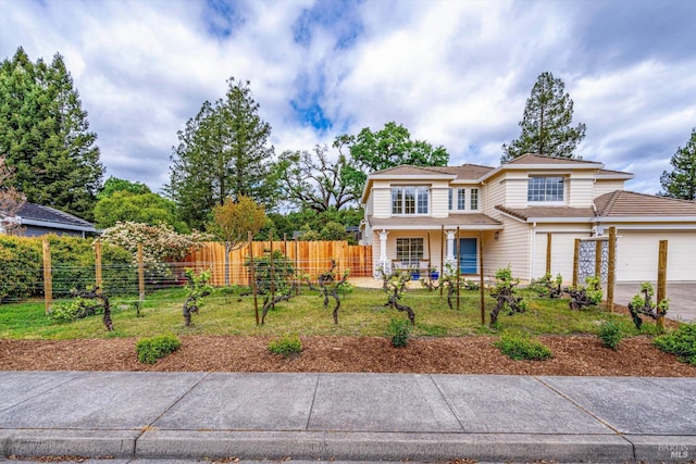 traditional-style home with fence