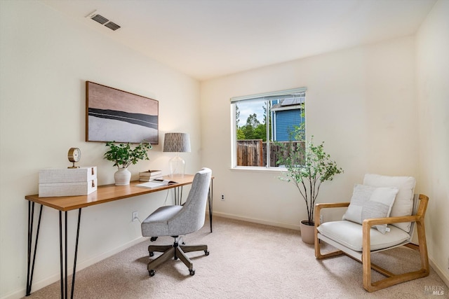 office with light carpet, baseboards, and visible vents