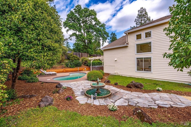 view of yard with fence and a patio