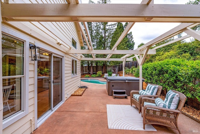 view of patio with a hot tub and a fenced backyard