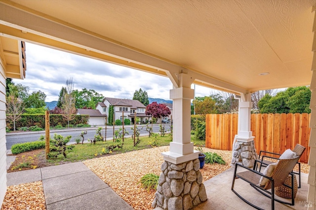 view of patio / terrace featuring fence