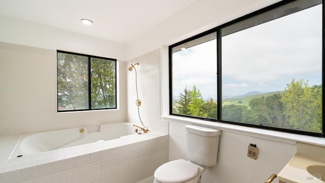 full bath with a wealth of natural light and toilet