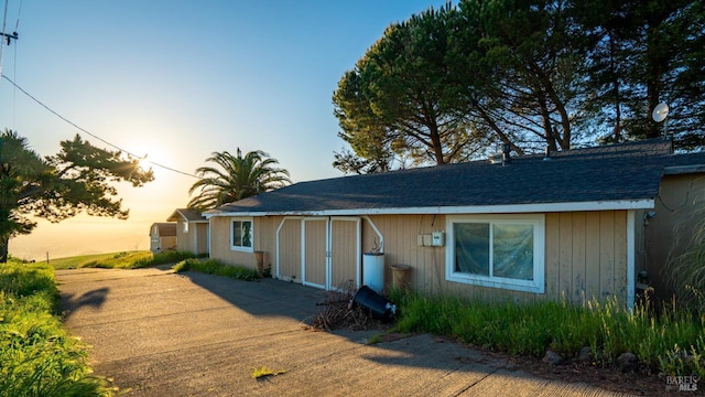 view of front of property with roof with shingles