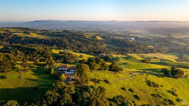 birds eye view of property featuring a mountain view