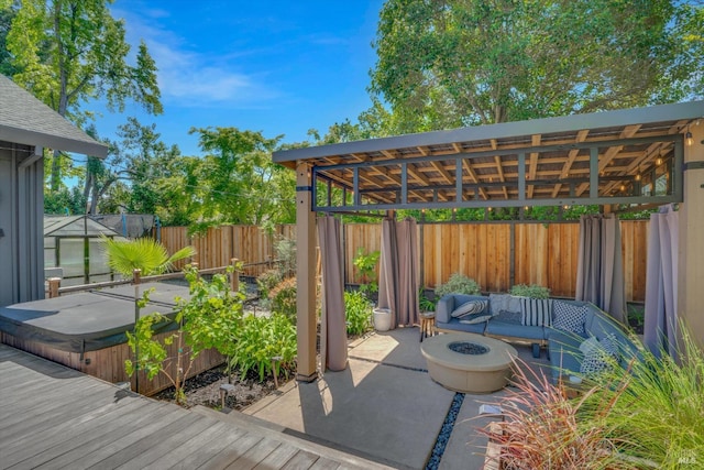 view of patio featuring a gazebo, a fenced backyard, an outdoor living space with a fire pit, a covered hot tub, and a wooden deck