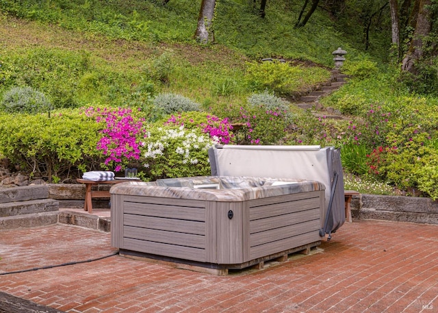 view of patio / terrace with a hot tub