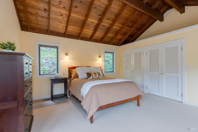 bedroom with wood ceiling, vaulted ceiling with beams, and light colored carpet