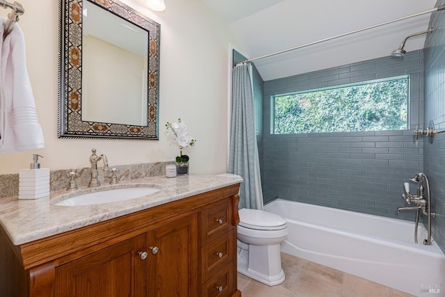 bathroom with shower / bath combo, vanity, tile patterned flooring, and toilet
