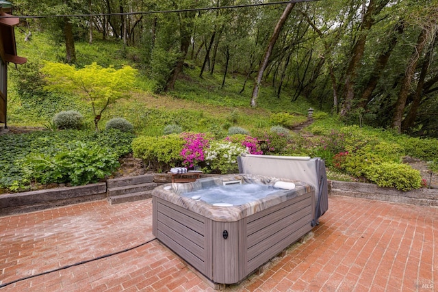 view of patio with a hot tub