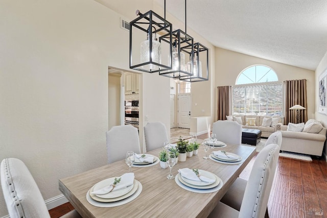1006 Armsby Way, Suisun City, CA 94585 - dining room with a textured ceiling, wood finished floors, baseboards, and high vaulted ceiling