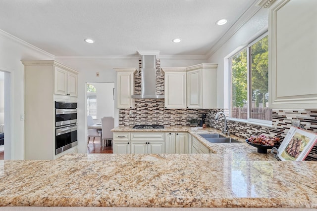1006 Armsby Way, Suisun City, CA 94585 - kitchen featuring a sink, appliances with stainless steel finishes, wall chimney range hood, tasteful backsplash, and light stone counters