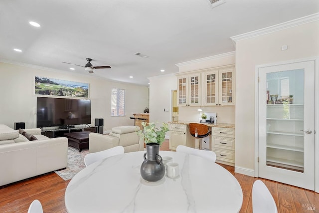 1006 Armsby Way, Suisun City, CA 94585 - dining area with ornamental molding, light wood-style flooring, a ceiling fan, recessed lighting, and baseboards