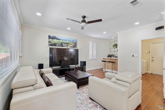 1006 Armsby Way, Suisun City, CA 94585 - living area featuring ceiling fan, ornamental molding, wood finished floors, recessed lighting, and baseboards