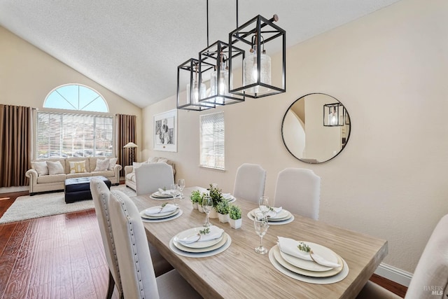 1006 Armsby Way, Suisun City, CA 94585 - dining area with vaulted ceiling, wood finished floors, a textured ceiling, and baseboards