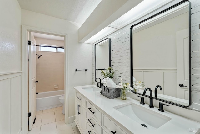 1006 Armsby Way, Suisun City, CA 94585 - bathroom with double vanity, toilet, a decorative wall, tile patterned flooring, and wainscoting