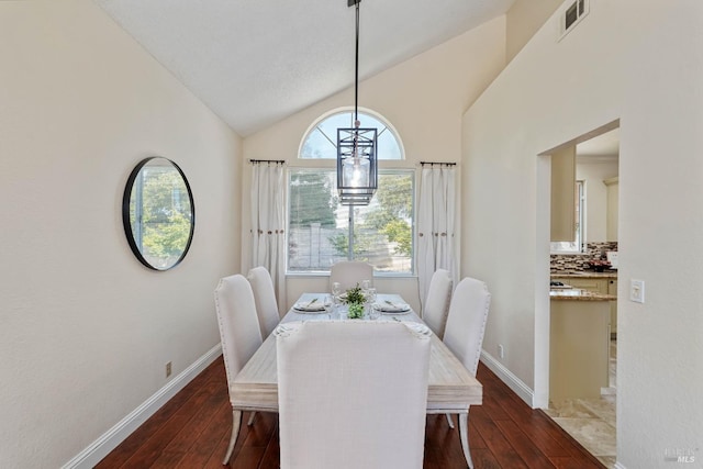 1006 Armsby Way, Suisun City, CA 94585 - dining area featuring dark wood-type flooring, baseboards, and high vaulted ceiling