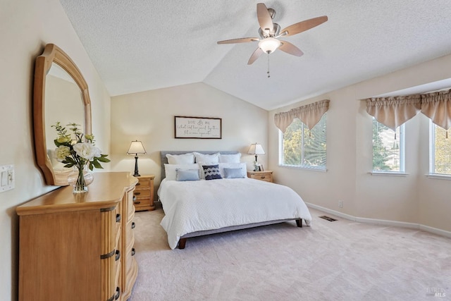 1006 Armsby Way, Suisun City, CA 94585 - bedroom with light colored carpet, a textured ceiling, lofted ceiling, baseboards, and a ceiling fan