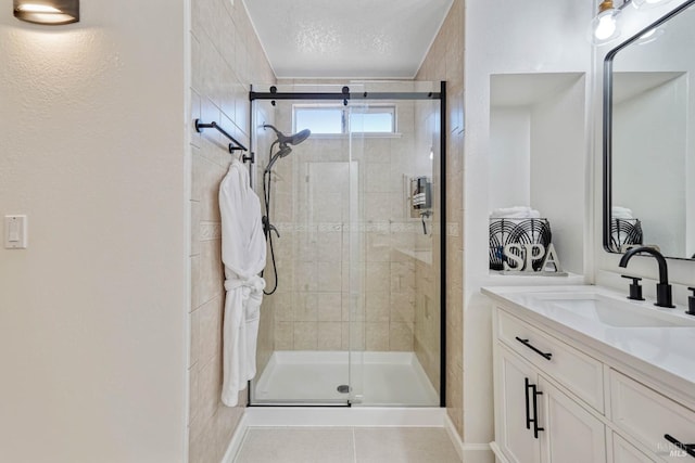 1006 Armsby Way, Suisun City, CA 94585 - full bathroom featuring a stall shower, vanity, a textured ceiling, and tile patterned floors