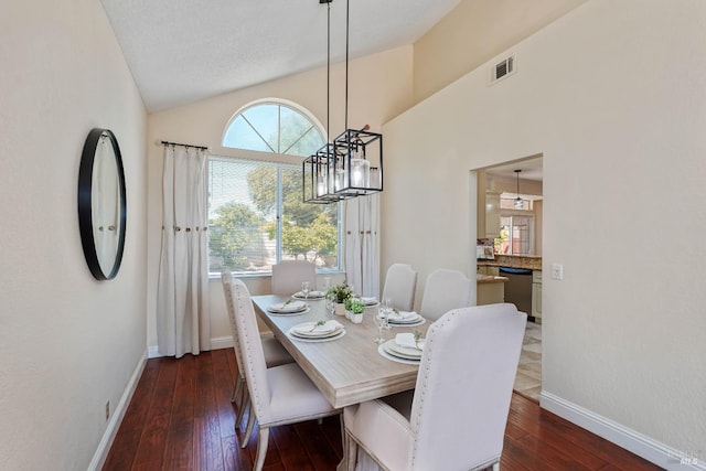 1006 Armsby Way, Suisun City, CA 94585 - dining room with baseboards, dark wood finished floors, a chandelier, and high vaulted ceiling