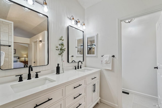 1006 Armsby Way, Suisun City, CA 94585 - ensuite bathroom with double vanity, tile patterned floors, and baseboards