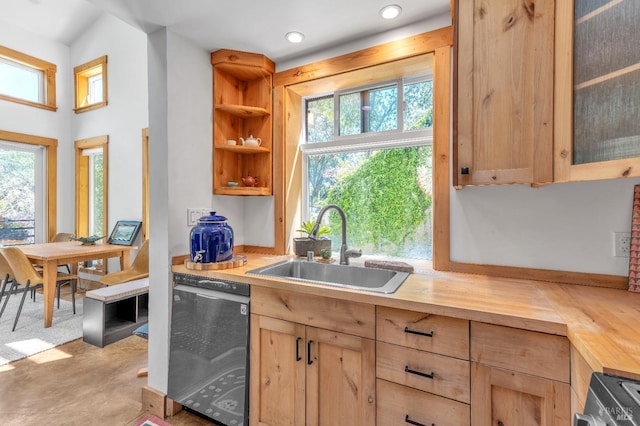 kitchen with light brown cabinets, wooden counters, glass insert cabinets, a sink, and dishwasher