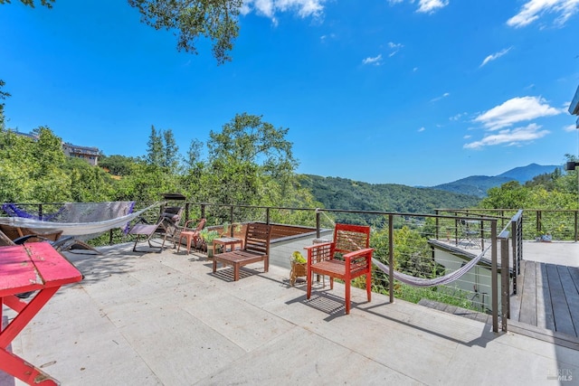 view of patio / terrace with a mountain view