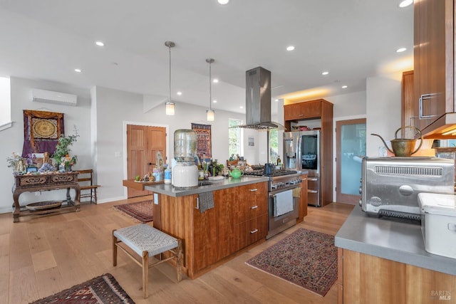 kitchen featuring appliances with stainless steel finishes, brown cabinetry, light wood-style flooring, island range hood, and a kitchen island