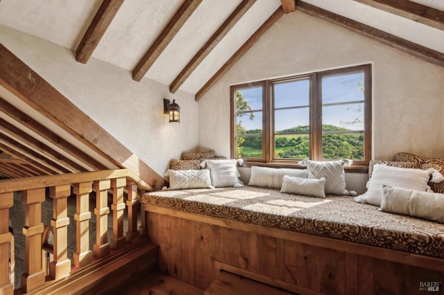 bedroom featuring lofted ceiling with beams