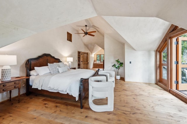 bedroom featuring vaulted ceiling, a ceiling fan, hardwood / wood-style floors, and access to exterior
