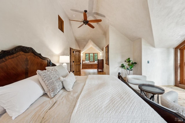 bedroom featuring lofted ceiling and a ceiling fan