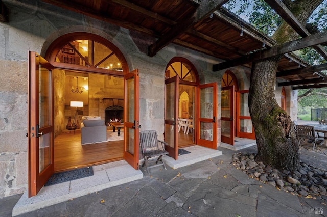 property entrance featuring stone siding