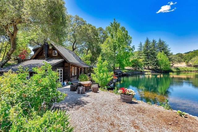 view of patio featuring a water view