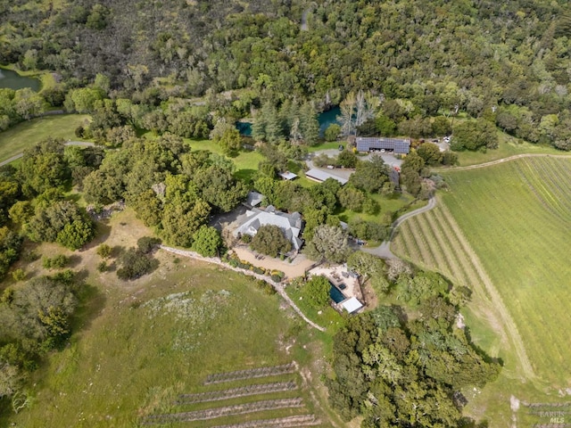 birds eye view of property with a rural view