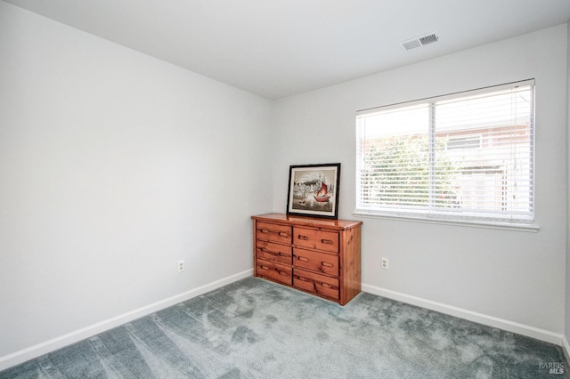 carpeted bedroom featuring visible vents and baseboards