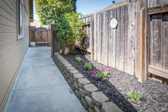 view of yard with fence and a gate